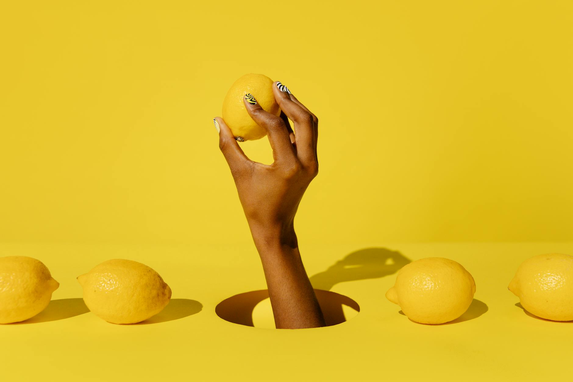 Close-up of hands holding a gentle personal massager, emphasizing a softer approach to clitoral stimulation