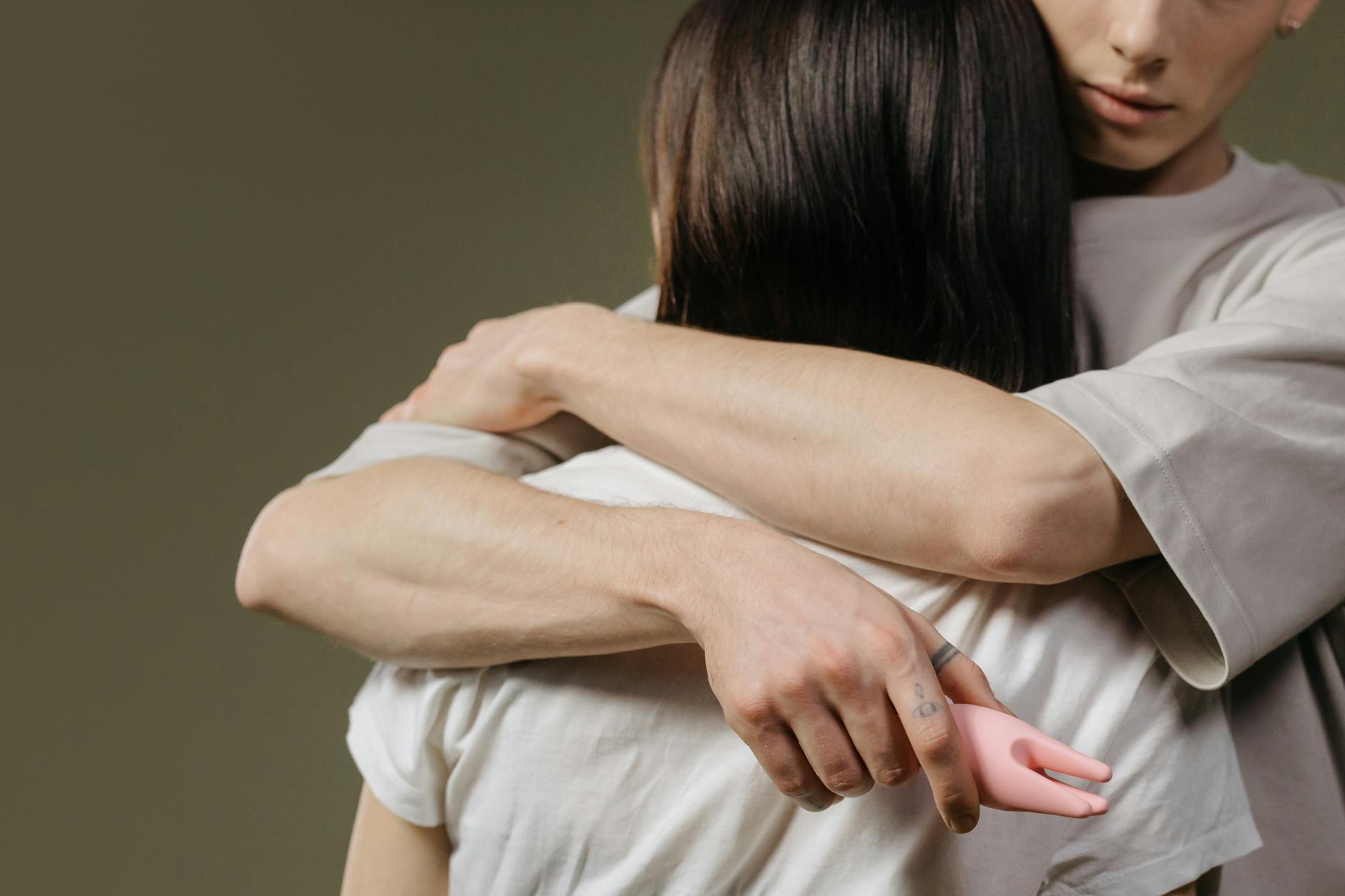 Close-up of a couple embracing, highlighting intimacy and connection across multiple relationships.